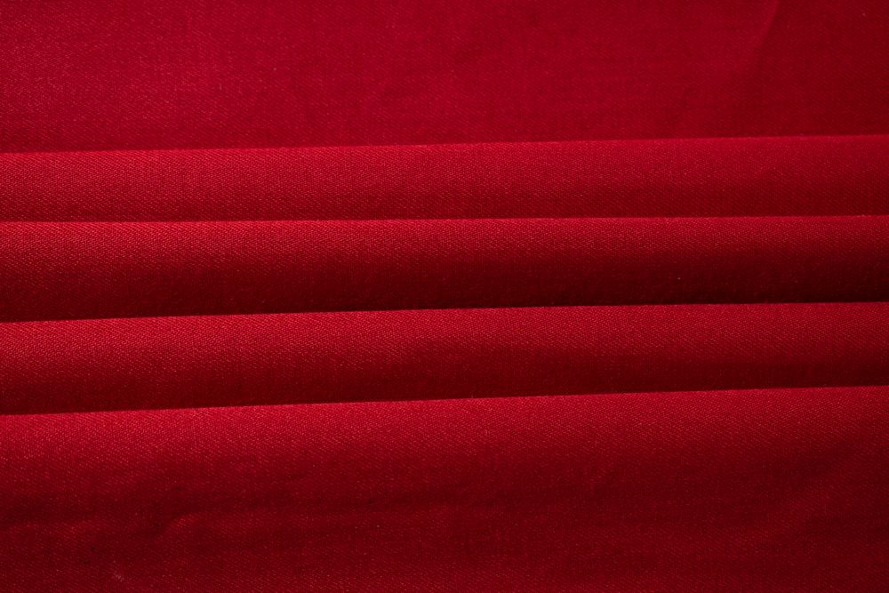 Folded Red fabric background texture.