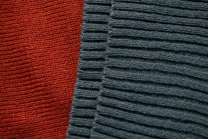 Close up dark grey knitted fabric background texture.