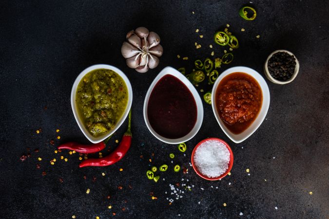Top view of three spicy colorful Georgian sauces