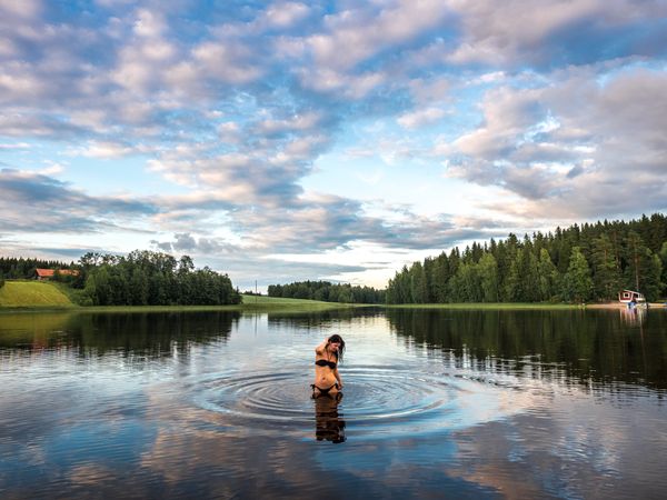 Woman in water in beautiful landscape
