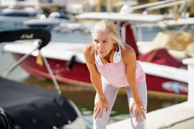 Mature sportswoman taking a break during exercise