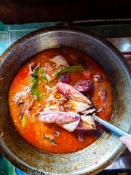 Cumi Balado or red chili squid. one of the typical Minangkabau dishes in Indonesia, fresh squid cooked with spicy chili sauce.