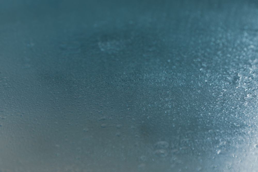 Metallic blue table with moisture