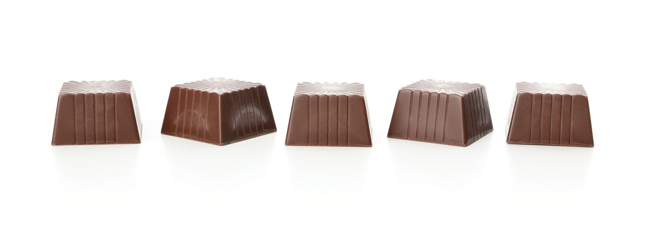 Tasty chocolate candies isolated on blank background