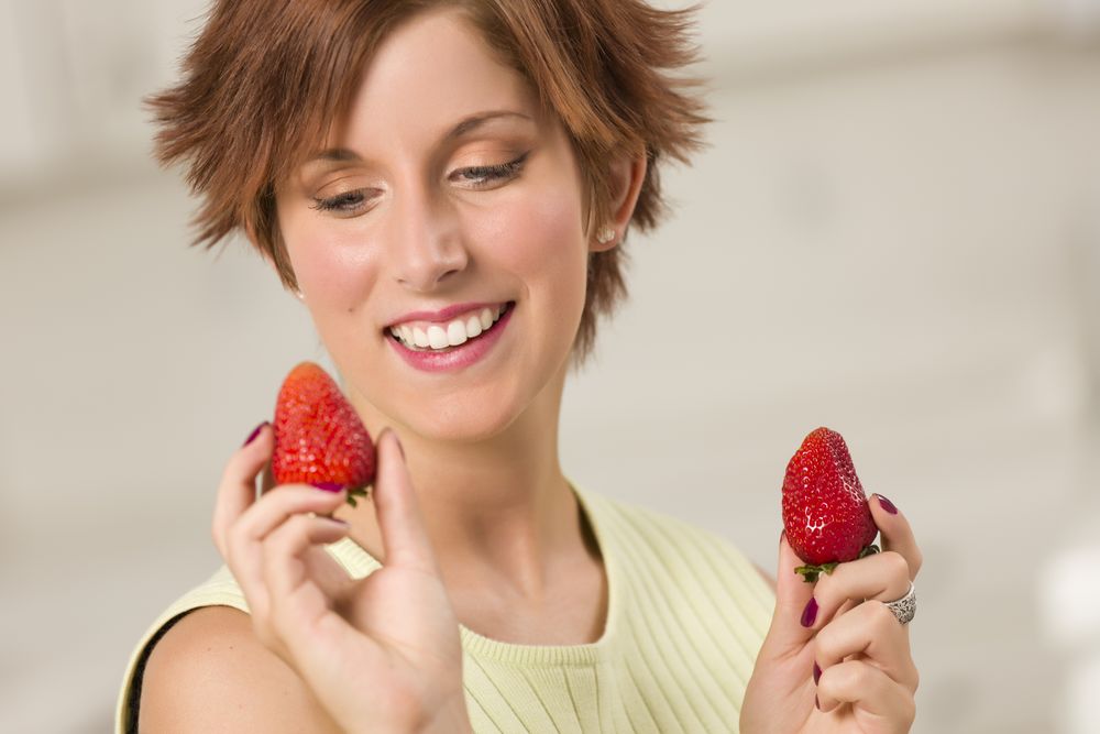 Red Haired Woman Holding Strawberry