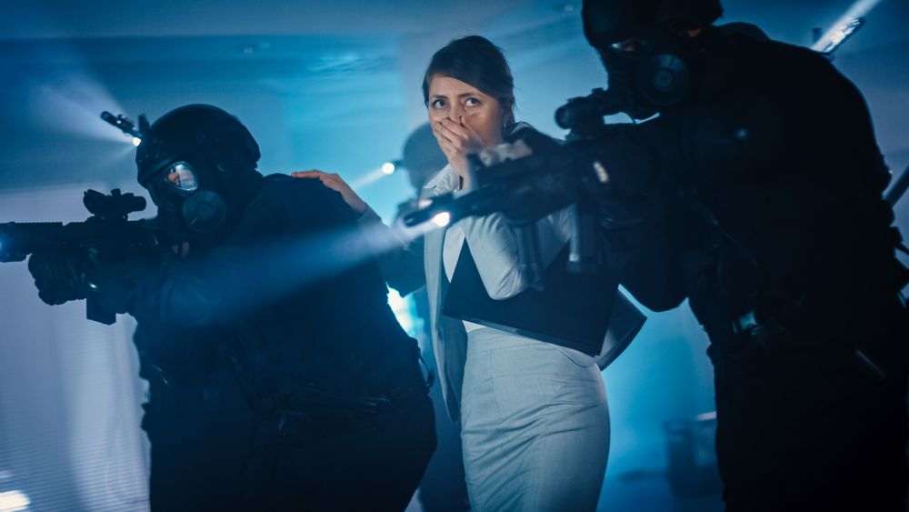 Soldiers with Rifles and Flashlights Move Forwards and Cover Surroundings.