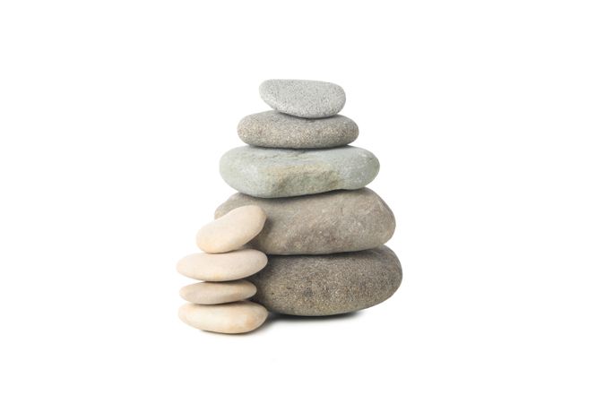 Stones one on top of other, isolated on plain background