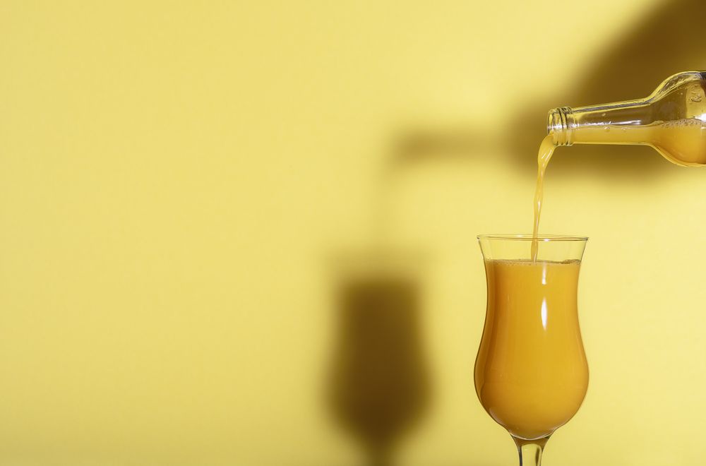 Pouring orange juice in a glass