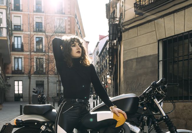 Young woman in custom motorbike