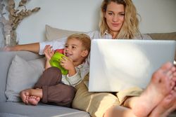 Woman and boy browsing netbook at home