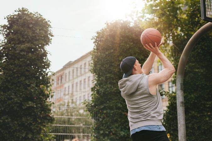 Streetball player playing on outdoor court