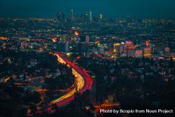 Long shot of car lights on highway of Los Angeles at night in California, United States bGX720