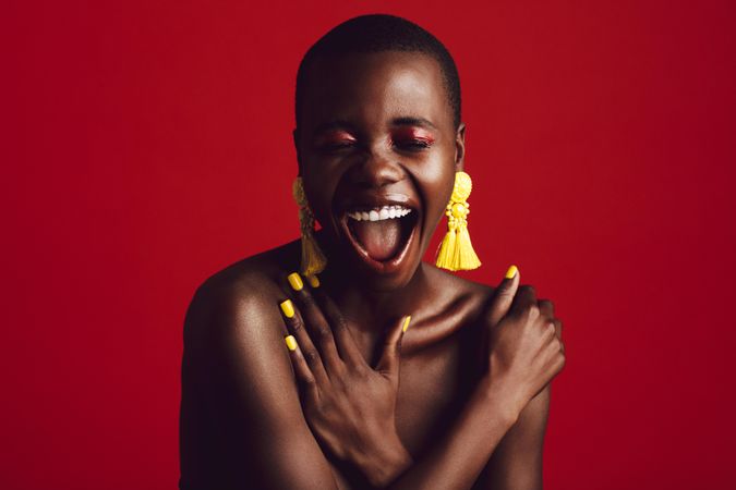 Beautiful African woman over red background