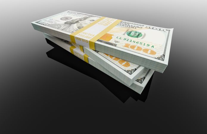 Stack of Thirty Thousand Dollars of One Hundred Dollar Bills on Reflective Surface.
