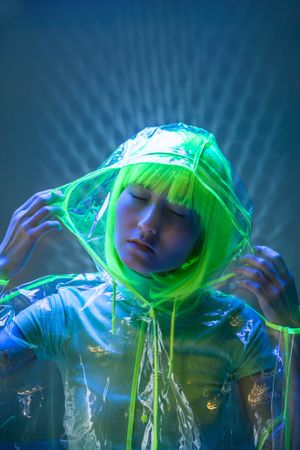 Asian woman posing in fluorescent light