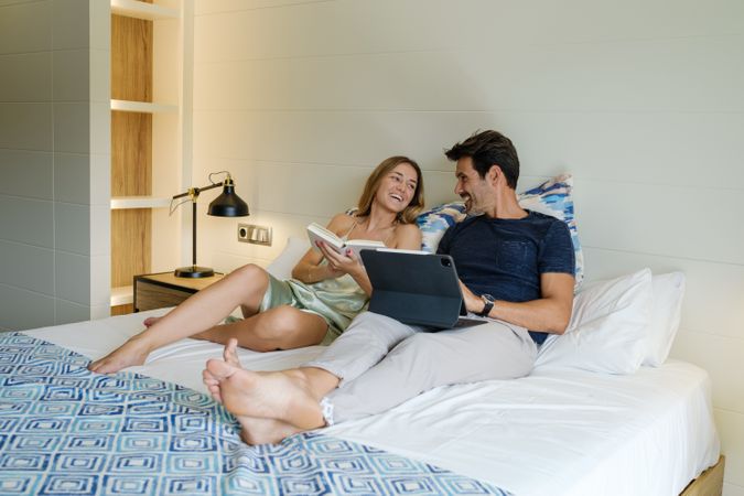 Couple spending time together on bed at home