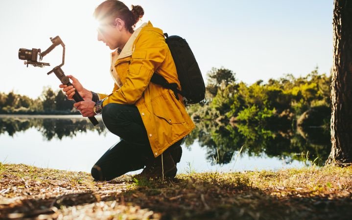 Man using advanced technology gadgets to shoot photos of nature