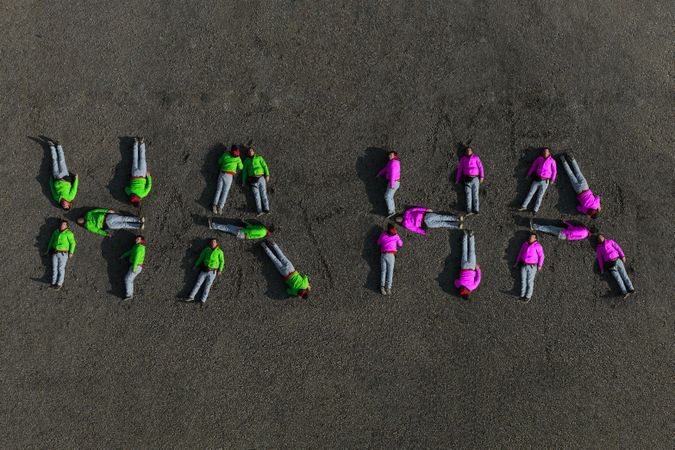 Aerial image of a man forming the text '''HA HA'''.
