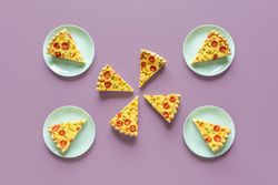 Quiche meal on a purple table, above view