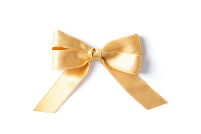 Gold bow isolated on plain background. Gift concept