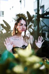 stylish woman looking through window