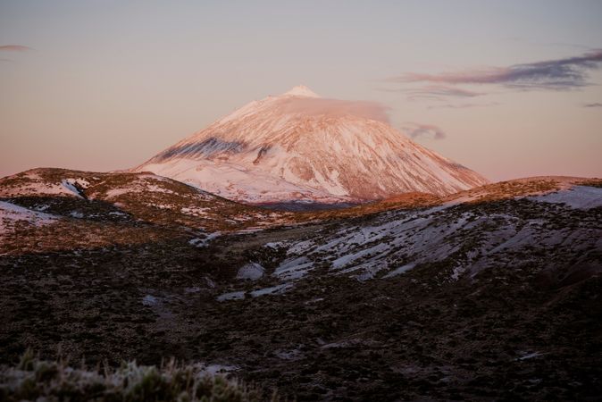 Clouds near snowy mountain