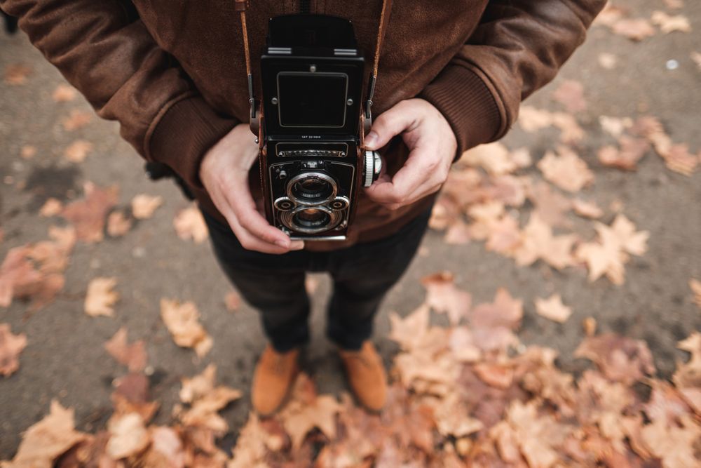 Crop traveler holding film in camera