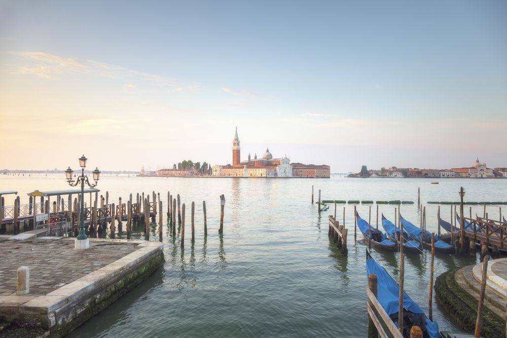 Venice, San Giorgio Maggiore church and gondolas at sunrise, Italy