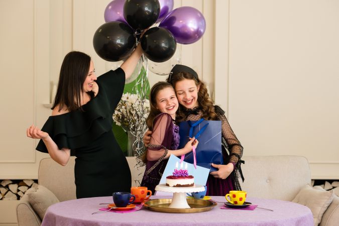 Mother and girls enjoying birthday
