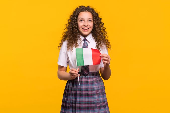 Smiling girl holding Italian flag