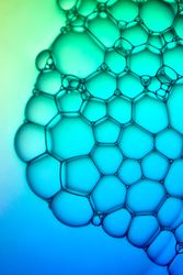 Abstract background bio technology, macro photography foam and water with gradient background. Molecule multicolor backgorund