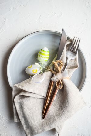 Easter table setting with small green pastel egg decor