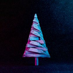 Christmas tree in vivid neon colors on dark  background