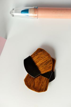Cosmetic pencils:, make up blue eyeliner pencil, modern background with pink chevron reliefs. make up concept