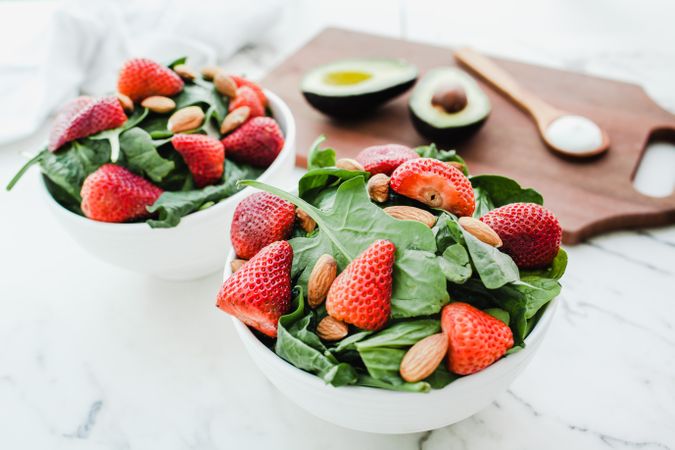 Strawberry served with almond and greenery