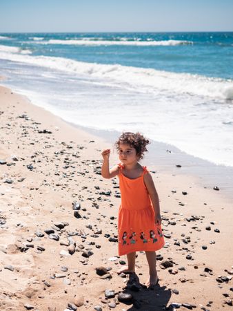Little girl playing on beach