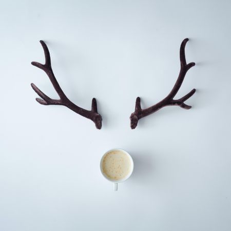 Brown antlers with coffee cup
