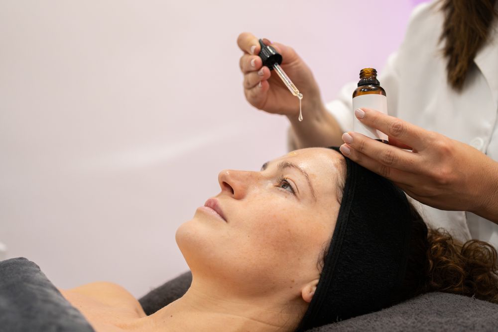 Side view of client having product dripped on forehead