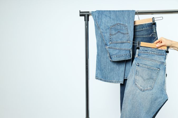 Jeans hang on hangers