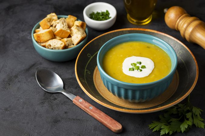 Bowl with pumpkin soup on the table.