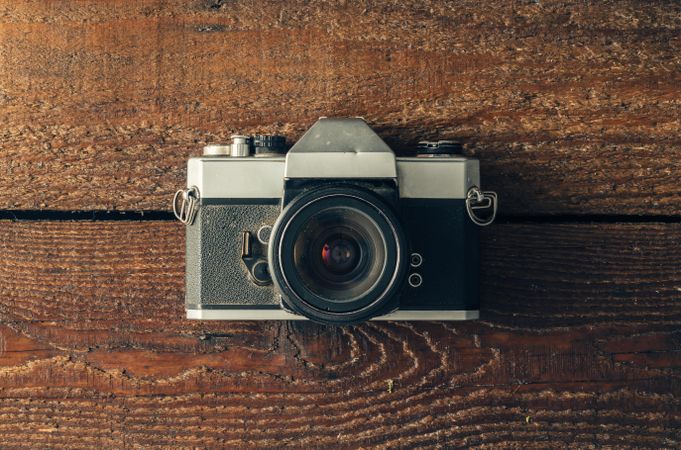 Vintage camera on wooden background