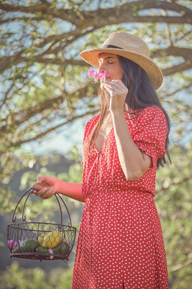 Woman with flower on summer walk