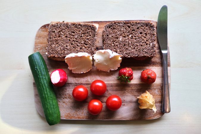 Close view on a healthy german breakfast with sandwiches, tomatoes and cucumbers