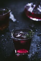Glasses and carafe with red wine on table