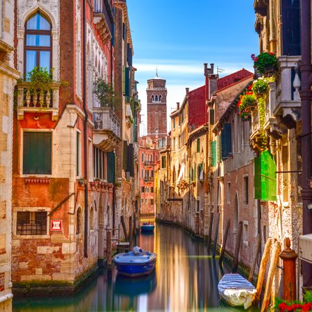 Venice cityscape, water canal, bell tower and traditional buildings, Italy