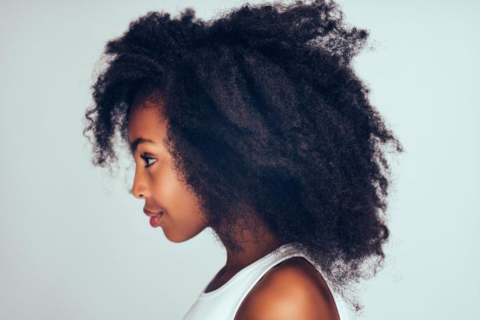 Side view serious girl wearing simple vest