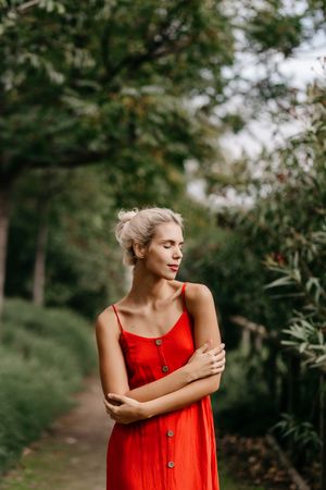 Dreamy young woman in summer garden