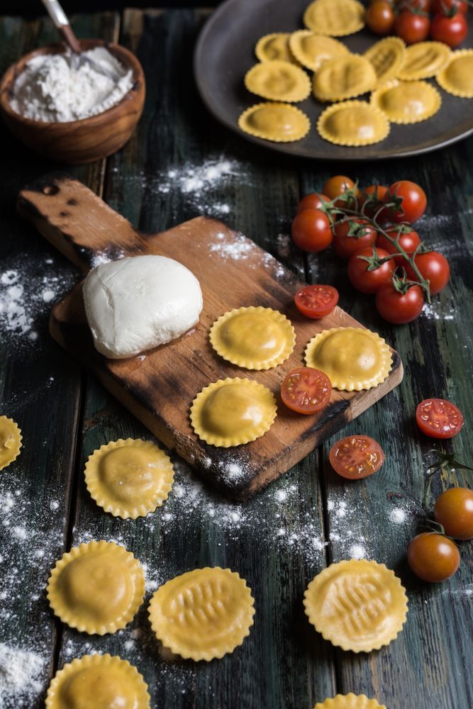Homemade ravioli made with parmesan cheese, tomato and basil.