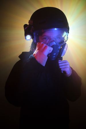 Boy in respirator with clenched fists
