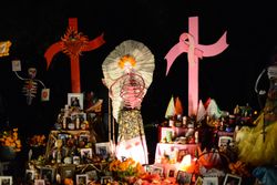 Altar with paper flower angel and pink ribbon cross for breast cancer